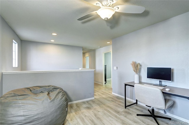 office featuring recessed lighting, light wood-type flooring, and baseboards