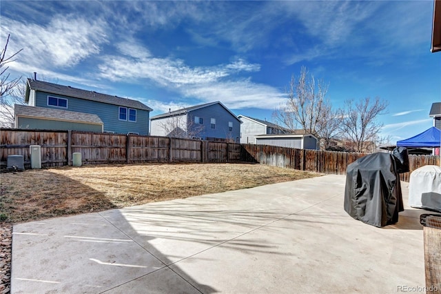 exterior space with a fenced backyard and a patio