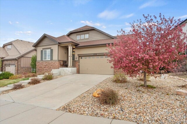 7790 S Queensburg Way, Aurora, CO 80016 - craftsman house with stone siding, concrete driveway, and a garage