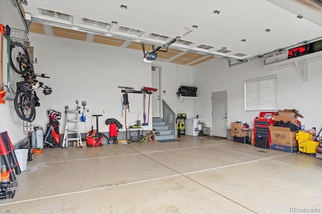 7790 S Queensburg Way, Aurora, CO 80016 - garage featuring a garage door opener