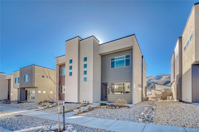 contemporary house featuring a mountain view