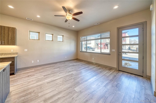 interior space featuring ceiling fan and light hardwood / wood-style floors