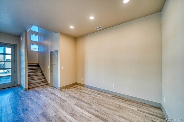 spare room with light hardwood / wood-style flooring