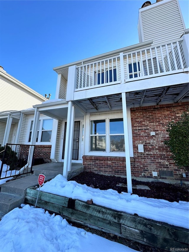 exterior space featuring a balcony