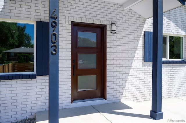 4903 W 11th Ave, Denver, CO 80204 - property entrance featuring brick siding