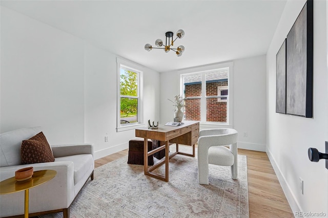 2391 Hudson St, Denver, CO 80207 - office space with a chandelier, light wood-type flooring, and baseboards