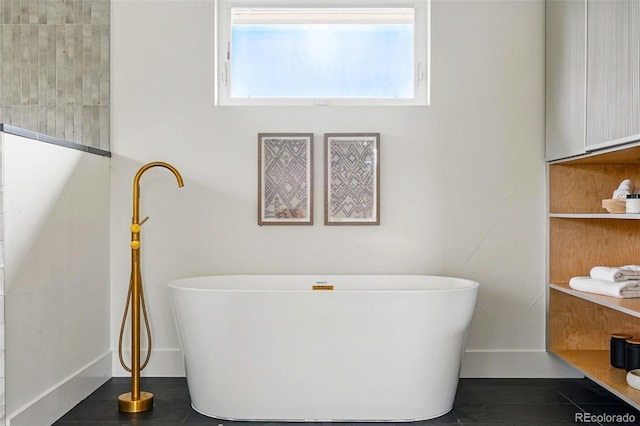 2391 Hudson St, Denver, CO 80207 - bathroom featuring a soaking tub and tile patterned floors