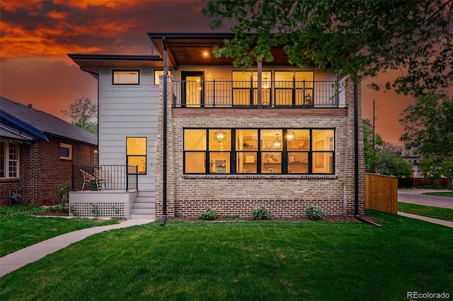 2391 Hudson St, Denver, CO 80207 - rear view of property with a balcony and a lawn