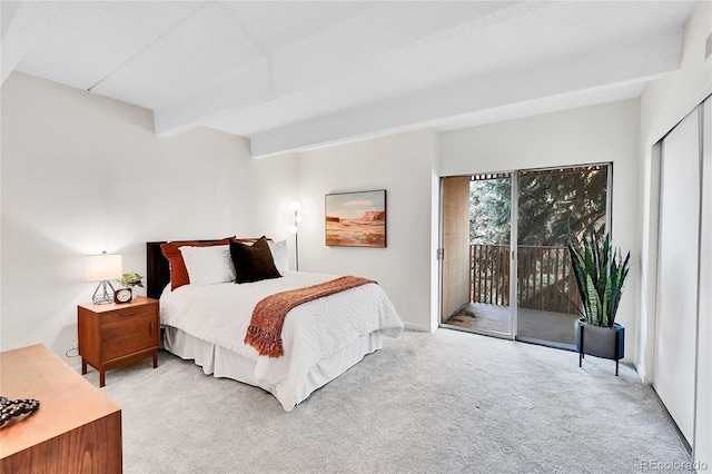 bedroom featuring beam ceiling, access to outside, and carpet flooring