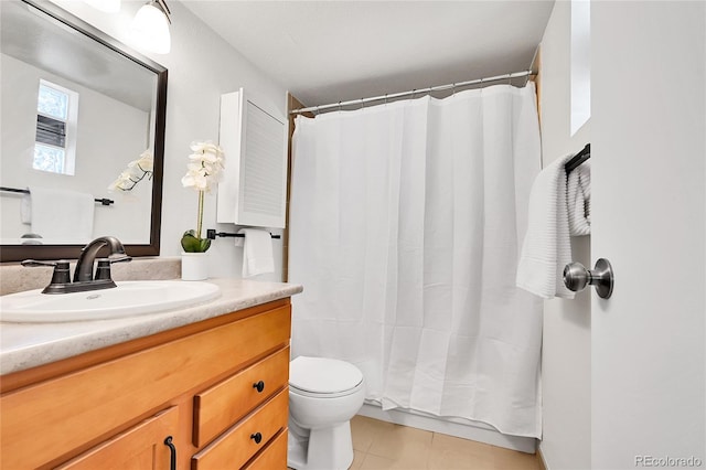 bathroom with tile patterned floors, a shower with curtain, toilet, and vanity