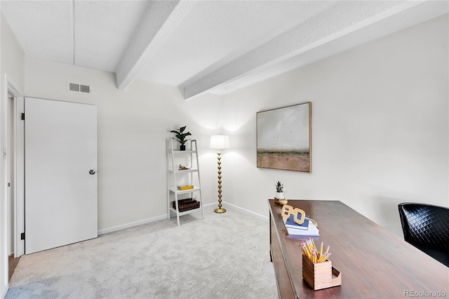 carpeted office space with baseboards, beamed ceiling, a textured ceiling, and visible vents