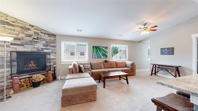 18274 W 58th Pl Unit 37, Golden, CO 80403 - living area featuring vaulted ceiling, carpet, a fireplace, and ceiling fan