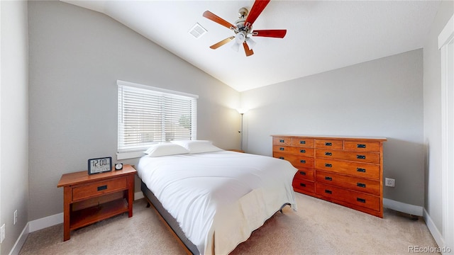 18274 W 58th Pl Unit 37, Golden, CO 80403 - bedroom with vaulted ceiling, light carpet, and ceiling fan