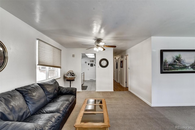 living room featuring carpet and ceiling fan