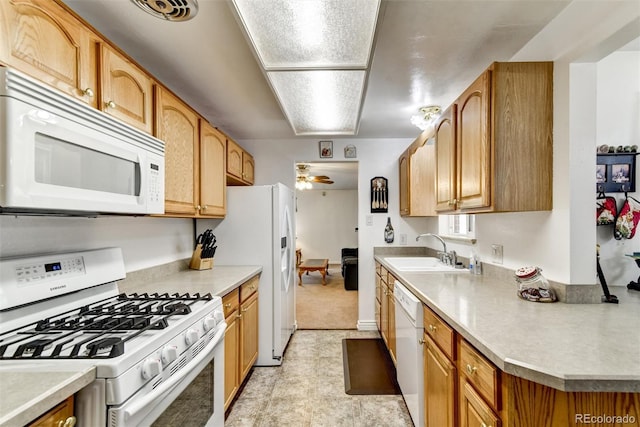 kitchen with ceiling fan, white appliances, and sink