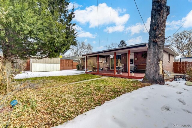 exterior space featuring a yard, a patio, and a deck