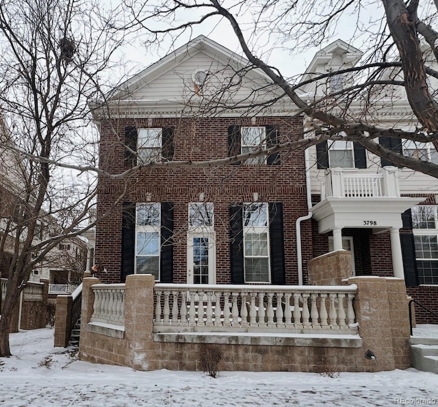 view of front of property featuring brick siding