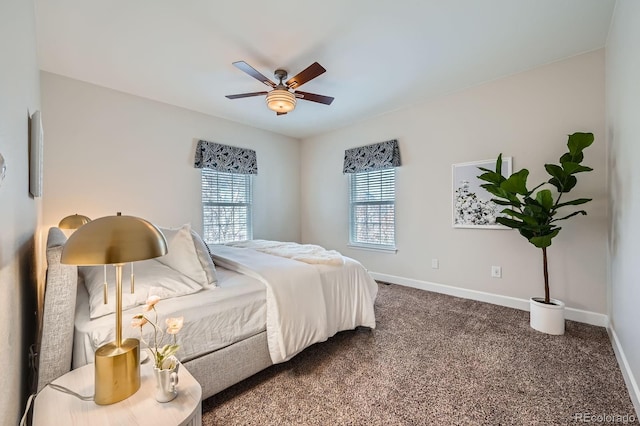 carpeted bedroom featuring ceiling fan and baseboards