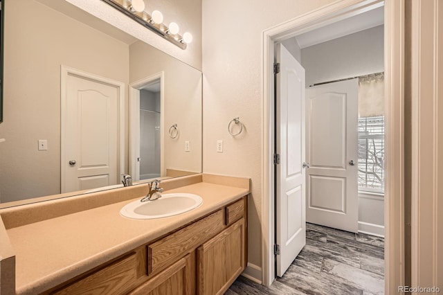 bathroom featuring vanity and wood finished floors