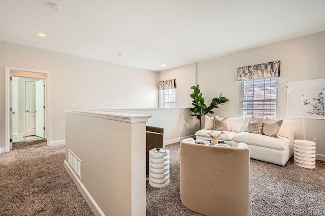 living room featuring baseboards, visible vents, carpet flooring, and recessed lighting