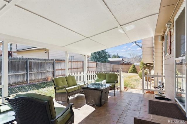 view of patio with a fenced backyard and an outdoor living space