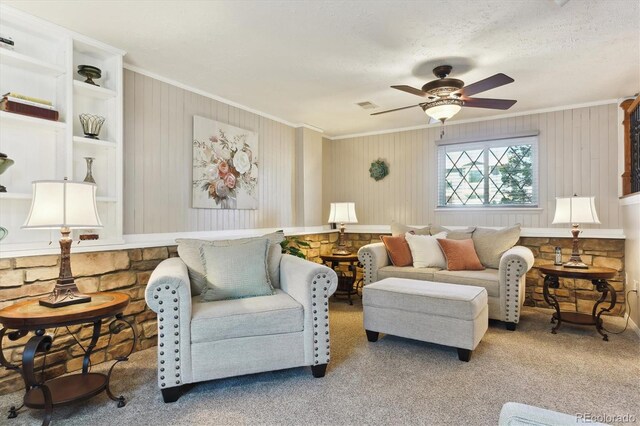 living area featuring carpet floors, visible vents, and ornamental molding