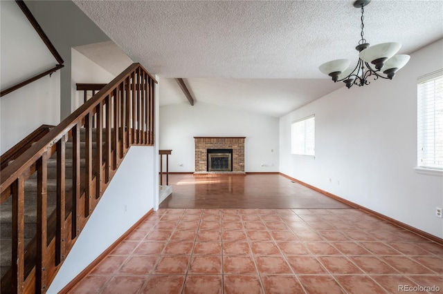 unfurnished living room with a textured ceiling, vaulted ceiling with beams, a notable chandelier, a brick fireplace, and light tile patterned floors