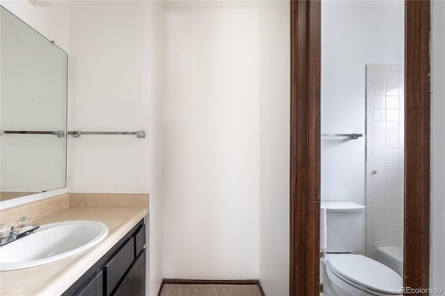 bathroom with toilet and vanity