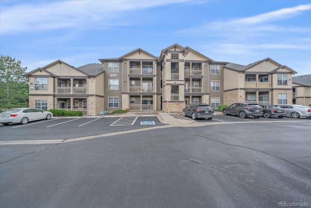 7413 S Quail Cir Unit 1435, Littleton, CO 80127 - view of apartment building / complex with uncovered parking