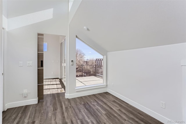 bonus room featuring dark hardwood / wood-style flooring and vaulted ceiling