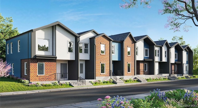 view of front of property with a residential view and brick siding