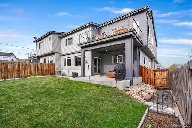 1353 Quaker St, Golden, CO 80401 - back of house featuring a balcony, a patio area, and a fenced backyard