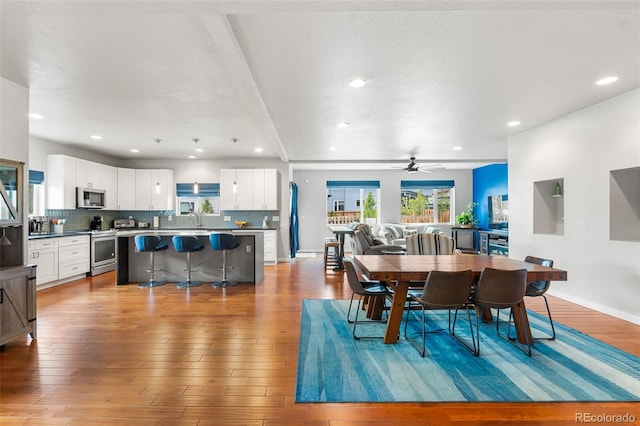 1353 Quaker St, Golden, CO 80401 - dining space featuring healthy amount of natural light, recessed lighting, light wood-type flooring, and a ceiling fan