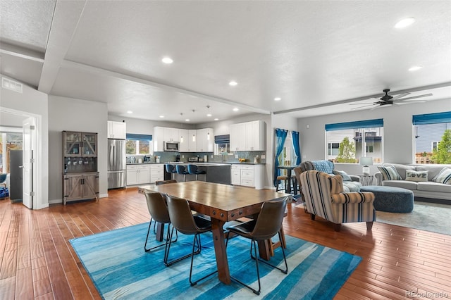 1353 Quaker St, Golden, CO 80401 - dining space featuring ceiling fan, recessed lighting, plenty of natural light, hardwood / wood-style floors, and beam ceiling