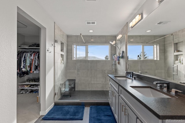 1353 Quaker St, Golden, CO 80401 - full bath with double vanity, a stall shower, tile patterned floors, a spacious closet, and recessed lighting