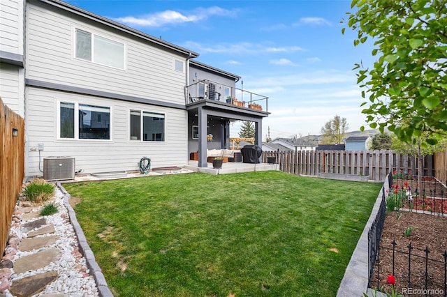1353 Quaker St, Golden, CO 80401 - back of house featuring a balcony, a fenced backyard, a patio area, a vegetable garden, and an outdoor living space