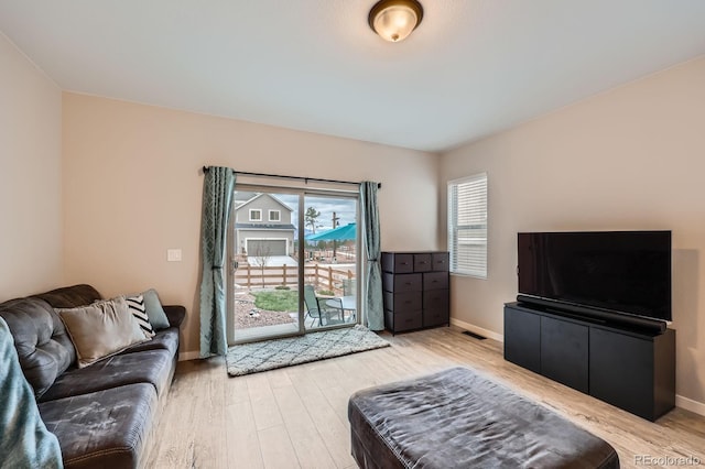 668 Sage Forest Ln, Monument, CO 80132 - living room with light wood finished floors and baseboards