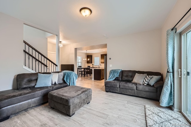 668 Sage Forest Ln, Monument, CO 80132 - living room featuring light wood finished floors and stairway