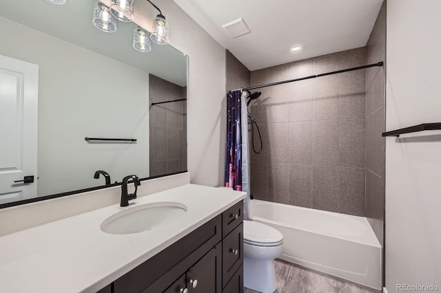 668 Sage Forest Ln, Monument, CO 80132 - bathroom featuring toilet, wood finished floors, shower / bath combination with curtain, and vanity