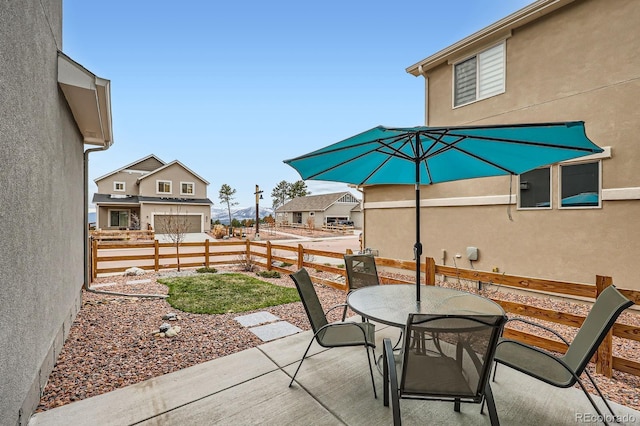 668 Sage Forest Ln, Monument, CO 80132 - view of patio / terrace featuring outdoor dining space and fence