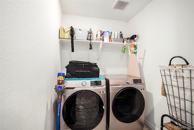 laundry room featuring washer and clothes dryer