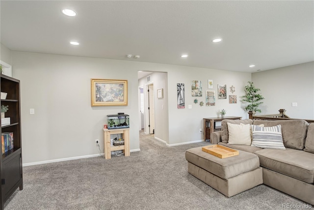 carpeted living room featuring recessed lighting and baseboards