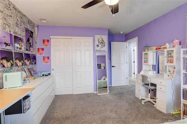 office space with ceiling fan and carpet flooring