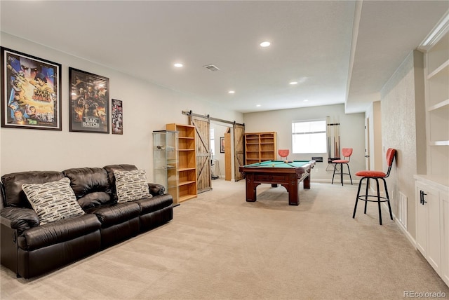 game room featuring a barn door, pool table, light carpet, recessed lighting, and baseboards