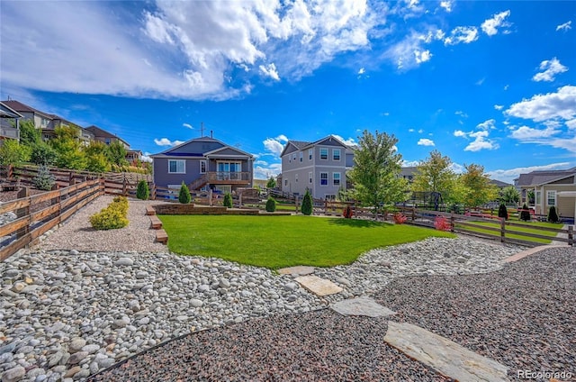 view of yard featuring stairs and a residential view