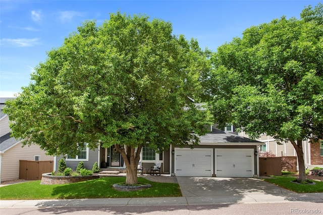7027 Chestnut Hill St, Highlands Ranch, CO 80130 - obstructed view of property with driveway and an attached garage