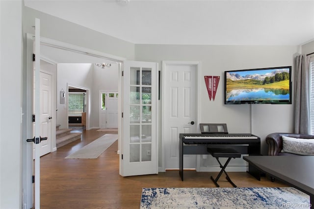 7027 Chestnut Hill St, Highlands Ranch, CO 80130 - office space featuring wood finished floors, a chandelier, and french doors