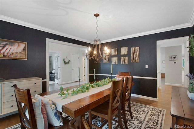 7027 Chestnut Hill St, Highlands Ranch, CO 80130 - dining room featuring a chandelier, wood finished floors, and crown molding
