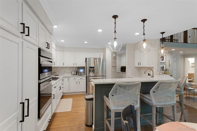 7027 Chestnut Hill St, Highlands Ranch, CO 80130 - kitchen featuring appliances with stainless steel finishes, backsplash, a peninsula, recessed lighting, and a breakfast bar area