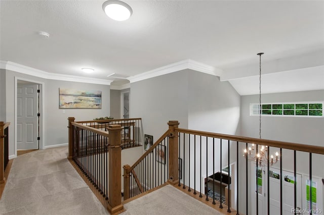 7027 Chestnut Hill St, Highlands Ranch, CO 80130 - hall with an upstairs landing, carpet floors, a chandelier, and crown molding